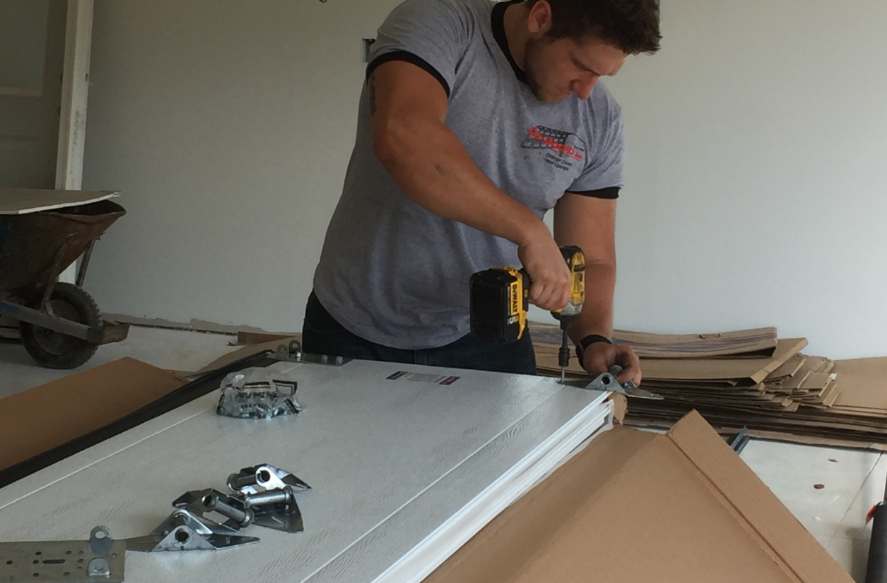 create an alt text tag for an image to improve the SEO of the website Bradenton FL Garage Door Services keyword: garage door repair