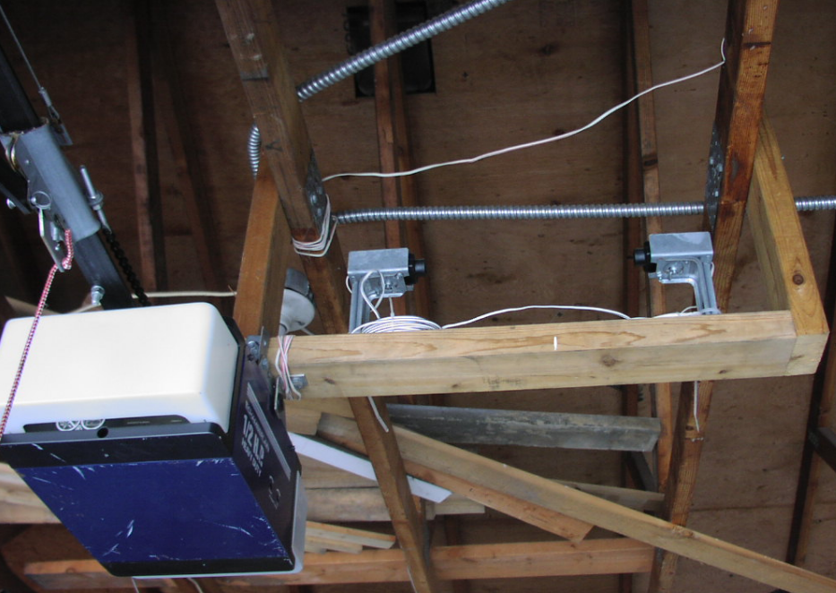 a technician repairing a garage door opener in Bradenton, FL, showcasing professional garage door services.